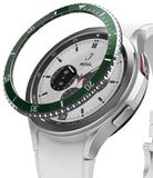Galaxy Watch 4 Classic 42mm | Bezel Styling - Galaxy Watch 4 Classic 42mm | A green bezel styling ring hovering above a silver smartwatch with a white strap.
