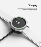 Galaxy Watch 4 Classic 42mm | Bezel Styling - Smartwatch with silver bezel styling charging on a wireless dock.