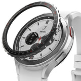 Galaxy Watch 4 Classic 42mm | Bezel Styling - Galaxy Watch 4 Classic 42mm - Black tachymeter bezel styling hovering above a silver smartwatch with a white strap.