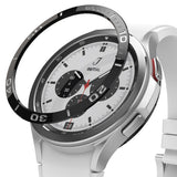 Galaxy Watch 4 Classic 46mm | Bezel Styling - A black numbered bezel ring hovering above a silver smartwatch with a white band.