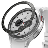 Galaxy Watch 4 Classic 46mm | Bezel Styling - Galaxy Watch 4 Classic 46mm | Black tachymeter bezel ring hovering above a silver smartwatch with a white chronograph face.