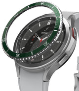 Galaxy Watch 4 Classic 46mm | Bezel Styling - Galaxy Watch 4 Classic 46mm - A green metallic bezel ring hovering above a silver smartwatch with a black analog watch face.