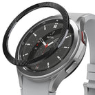 Galaxy Watch 4 Classic 46mm | Bezel Styling - A black textured metal bezel ring hovering above a silver smartwatch.