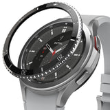 Galaxy Watch 4 Classic 46mm | Bezel Styling - A black adhesive bezel ring hovering above a silver smartwatch face.