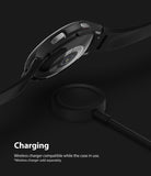 Galaxy Watch 4 Classic 42mm Case | Slim - Black smartwatch in a protective case hovering above a wireless charger.