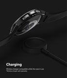 Galaxy Watch 4 Classic 42mm Case | Slim - Black smartwatch with protective case hovering above a wireless charger.