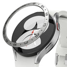 Galaxy Watch 5/4 40mm | Bezel Styling - Silver metallic bezel ring hovering above a white smartwatch with a black screen.