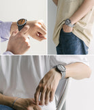 Galaxy Watch 4 44mm | Air Sports Black + Bezel Styling - Three views of a smartwatch with a black bezel and gray band.