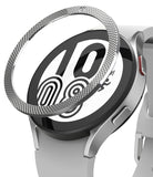 Galaxy Watch 5 / 4 (44mm) | Premium Bezel Styling - A silver textured bezel ring hovering above a Galaxy smartwatch.