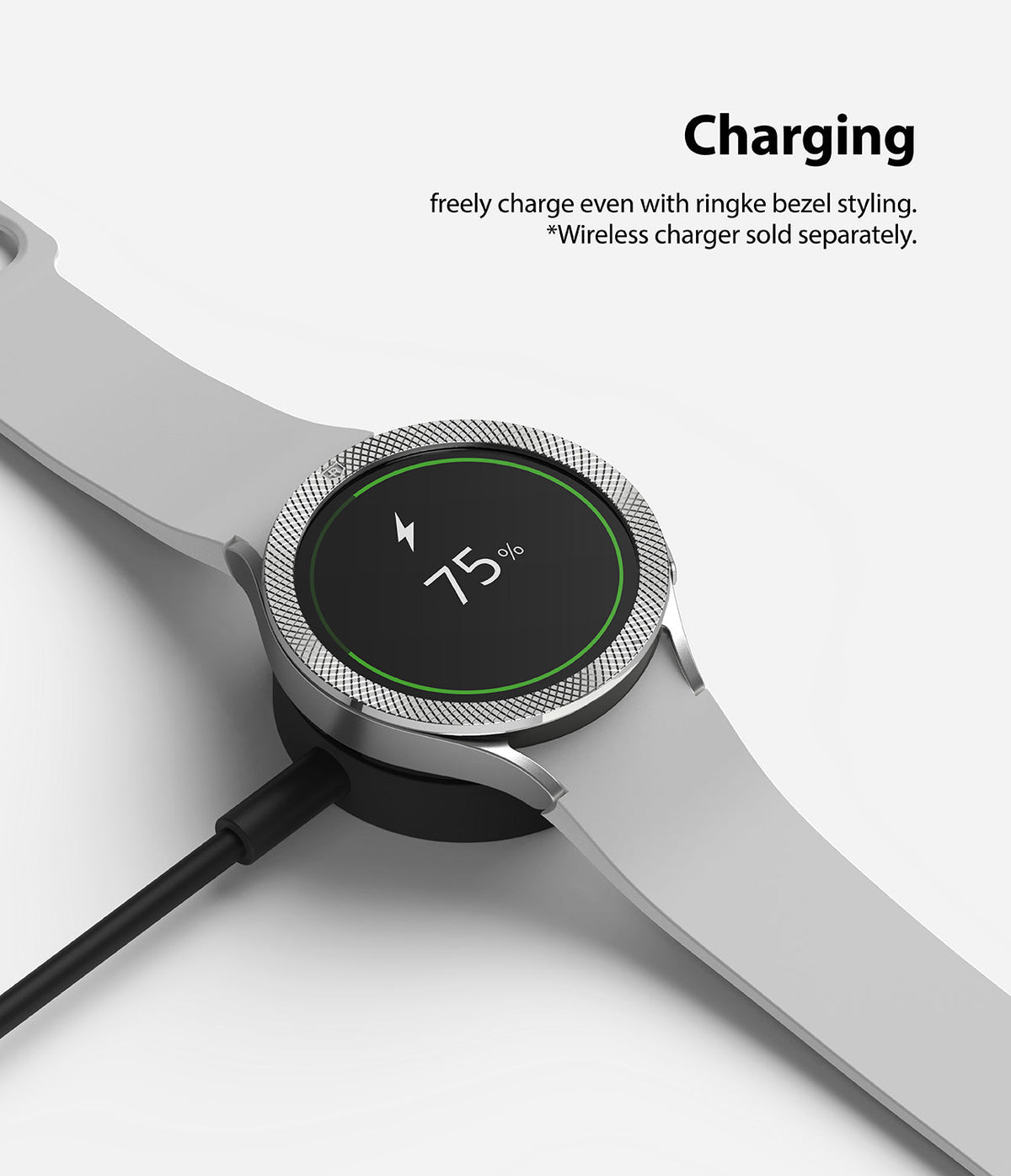 Galaxy Watch 5 / 4 (44mm) | Premium Bezel Styling - Smartwatch with silver bezel styling charging on a wireless dock.
