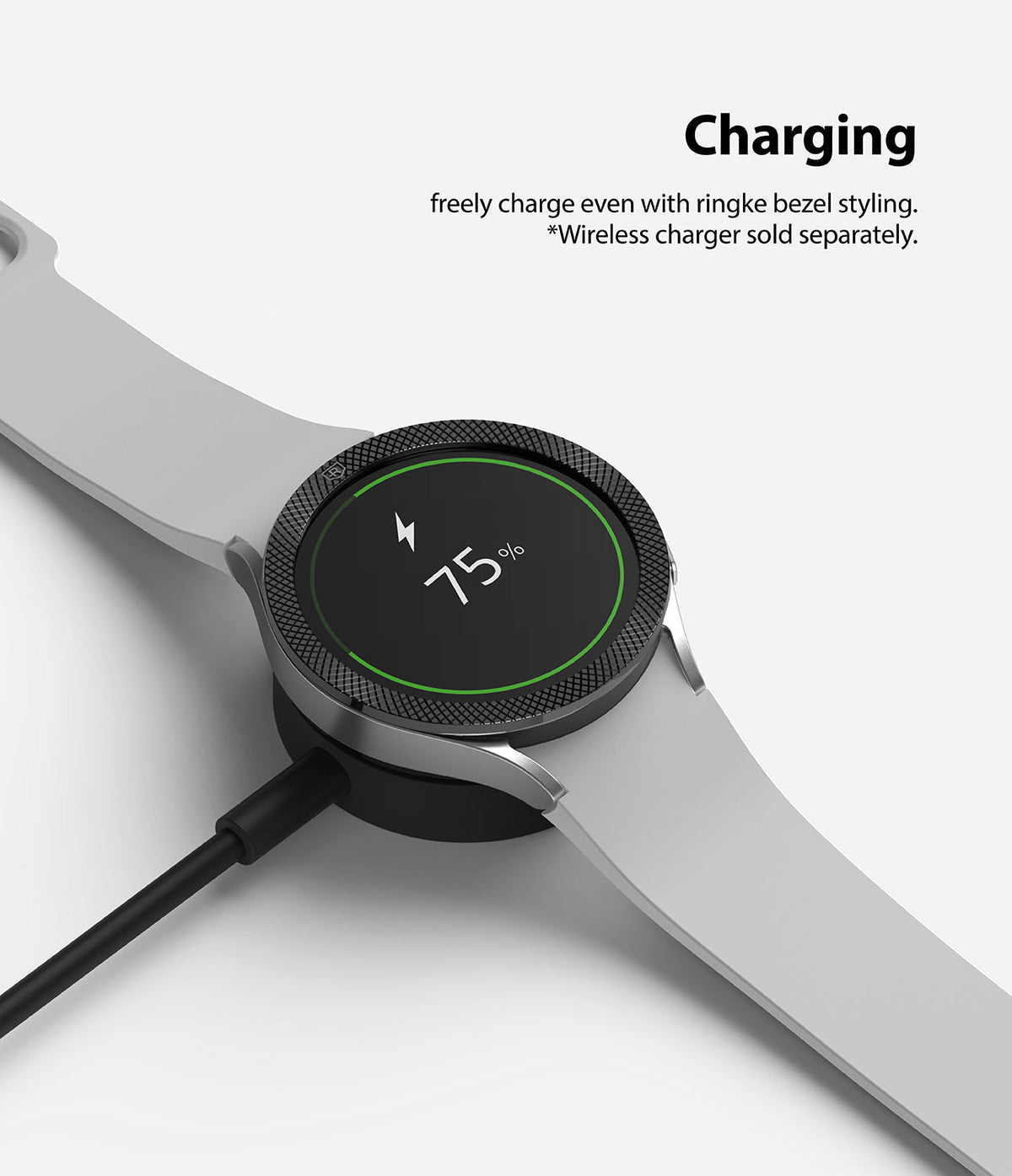 Galaxy Watch 5 / 4 (44mm) | Premium Bezel Styling - Smartwatch with textured bezel ring charging on a wireless dock.