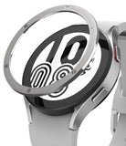 Galaxy Watch 5 / 4 (44mm) | Premium Bezel Styling - A metallic bezel ring hovering above a silver smartwatch face.