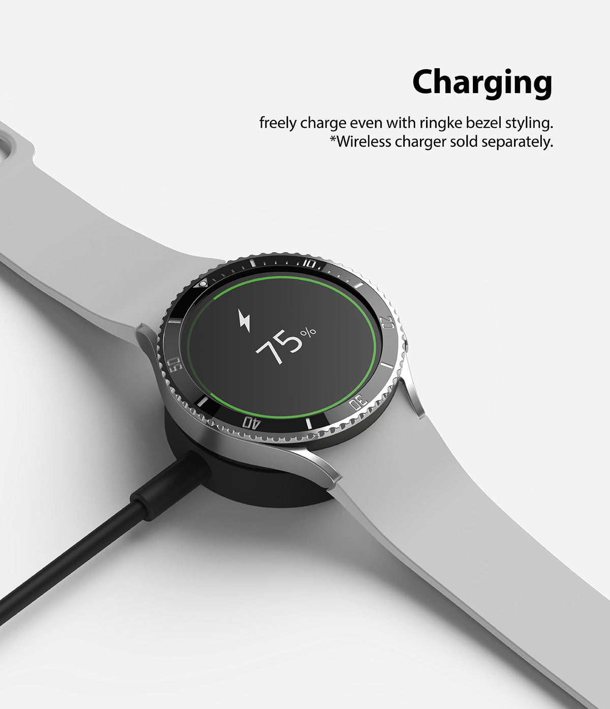 Galaxy Watch 5 / 4 (44mm) | Premium Bezel Styling - Smartwatch with bezel styling on a wireless charger showing 75% battery.