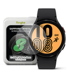 Galaxy Watch 5 / 4 (44mm) Screen Protector | Sapphire Crystal Glass - Galaxy Watch 5 / 4 (44mm) Screen Protector - Sapphire glass protector hovering over a black smartwatch with orange face.