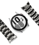 Galaxy Watch 6 / 5 / 4 (44mm) | Metal One Band - Silver smartwatch face with digital clock and two metal link bands.