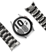 Galaxy Watch 6 / 5 / 4 (44mm) | Metal One Band - Silver smartwatch face with digital clock and two metal link bands.