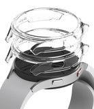 Galaxy Watch 4 (44mm) Case | Slim - Two transparent protective cases hovering above a silver Galaxy Watch 4.