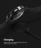 Galaxy Watch 4 (44mm) Case | Slim - Black smartwatch in a slim protective case hovering above a wireless charging puck.