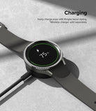 Galaxy Watch 5 Pro 45mm | Bezel Styling - Smartwatch with a metallic bezel ring charging on a wireless dock at 75%.