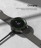 Galaxy Watch 5 Pro 45mm | Bezel Styling - Black smartwatch with bezel styling charging on a wireless dock at 75%.
