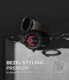 Galaxy Watch 5 Pro (45mm) | Premium Bezel Styling - Black smartwatch with metallic bezel accessories on a concrete block.