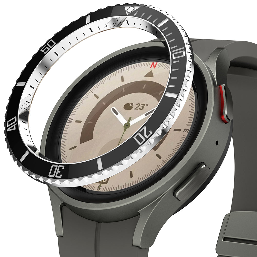 Galaxy Watch 5 Pro (45mm) | Premium Bezel Styling - A black, numbered watch bezel hovering above a grey Galaxy Watch 5 Pro.