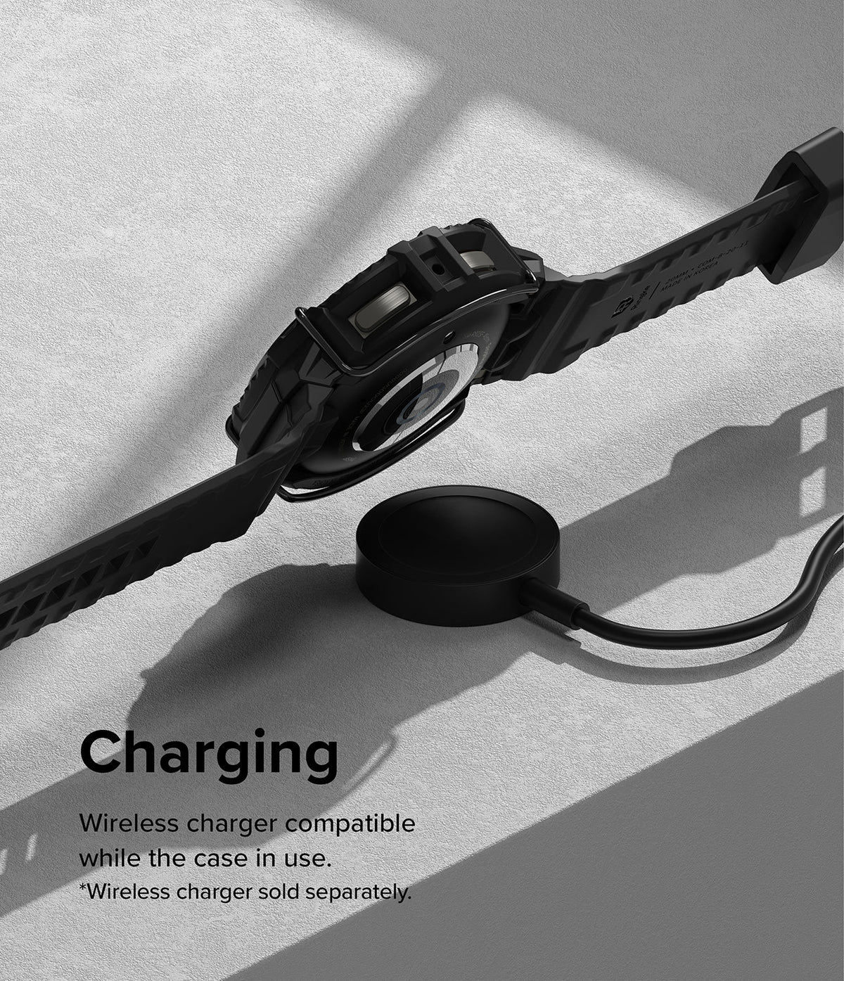 Galaxy Watch 5 Pro (45mm) Case + Band + Wire | Fusion-X Guard - Smartwatch in a black protective case charging wirelessly.