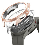 Galaxy Watch 5 Pro Case | Slim - Rose gold and clear protective watch cases hovering above a grey Galaxy Watch 5 Pro.