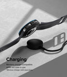 Galaxy Watch 5 40mm | Air Sports Black + Bezel Styling - Smartwatch with protective case hovering over a wireless charger.
