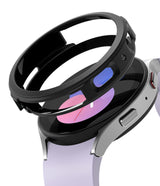 Galaxy Watch 5 40mm Case | Air Sports - A black protective watch case hovering above a silver Galaxy Watch 5 with a lavender band.