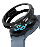 Galaxy Watch 5 44mm Case | Air Sports - Black protective watch case hovering above a blue Galaxy Watch 5.