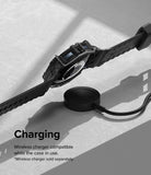 Galaxy Watch 5 / 4 (44mm) Case + Band + Wire | Fusion-X Guard - Smartwatch in a rugged black case charging wirelessly.