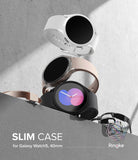 Galaxy Watch 5 (40mm) Case | Slim - Three Galaxy Watch 5 units in white, pink, and black stacked on a concrete surface.