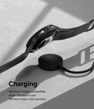 Galaxy Watch 5 44mm Case | Slim - Black smartwatch with protective case resting on a wireless charging puck.