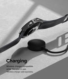 Galaxy Watch 5 44mm Case | Slim - A black Galaxy Watch 5 with a slim case hovering above a wireless charging puck.