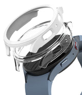 Galaxy Watch 5 44mm Case | Slim - A white protective case hovering above a blue Galaxy Watch 5 44mm.