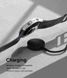 Galaxy Watch 5 44mm Case | Slim - White protective case on a Galaxy Watch 5 resting on a black wireless charging puck.