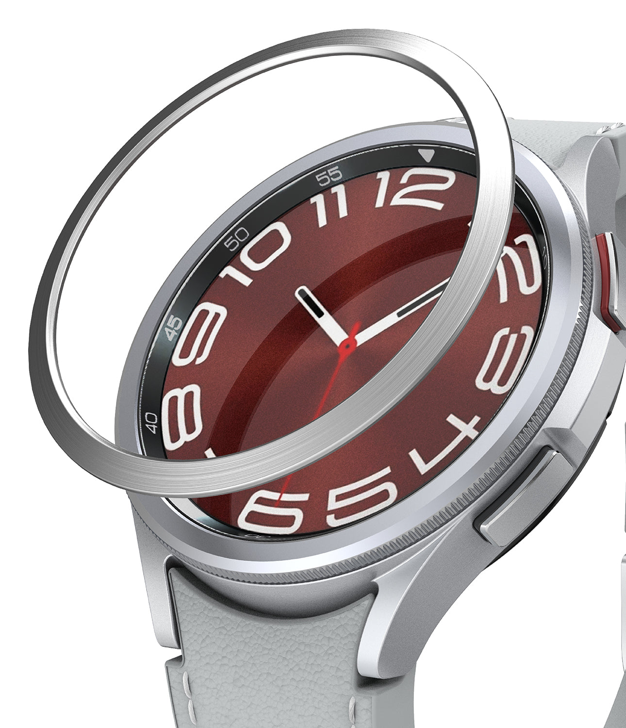 Galaxy Watch 6 Classic 43mm | Bezel Styling - Galaxy Watch 6 Classic 43mm - A silver metal bezel ring hovering above a smartwatch with a red dial and white numerals.