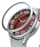 Galaxy Watch 6 Classic 43mm | Bezel Styling - Galaxy Watch 6 Classic 43mm - A silver metal bezel ring hovering above a smartwatch with a red dial and white numerals.