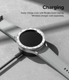 Galaxy Watch 6 Classic 43mm | Premium Bezel Styling - Smartwatch with tachymeter bezel styling charging on a wireless dock.