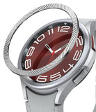 Galaxy Watch 6 Classic 47mm | Premium Bezel Styling - Silver textured bezel ring hovering above a smartwatch with a red face.