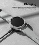 Galaxy Watch 6 Classic 47mm | Premium Bezel Styling - Watch with textured silver bezel accessory charging on a base.