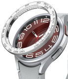 Galaxy Watch 6 Classic 47mm | Premium Bezel Styling - Galaxy Watch 6 Classic 47mm - A silver tachymeter bezel ring hovering above a smartwatch with a deep red dial.