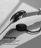 Galaxy Watch 6 Classic 43mm Case | Slim - Black protective watch case on a Galaxy Watch 6 hovering over a wireless charger.