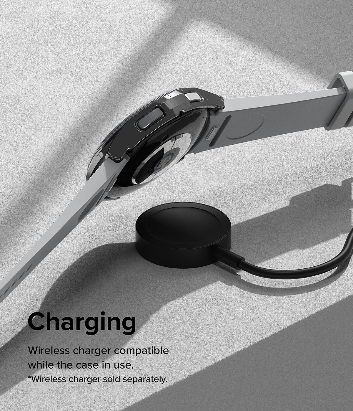 Galaxy Watch 6 Classic 43mm Case | Slim - A black protective case on a smartwatch hovering above a wireless charging puck.