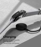 Galaxy Watch 6 Classic 47mm Case | Slim - Smartwatch with protective case hovering above a wireless charging puck.