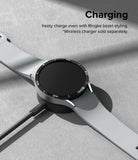 Galaxy Watch 6 44mm | Bezel Styling - A Galaxy Watch 6 with a black bezel accessory charging on a wireless dock.