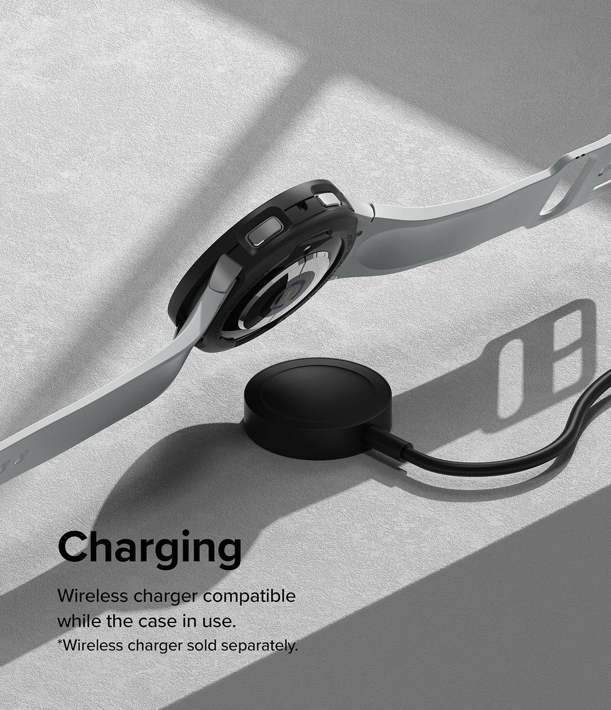 Galaxy Watch 6 44mm Case | Air Sports - Black protective case on a smartwatch hovering above a wireless charging puck.