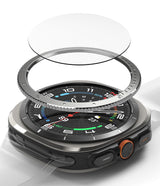 Galaxy Watch Ultra | Bezel Styling & Glass - Exploded view of a smartwatch with a protective glass layer and metal bezel ring.