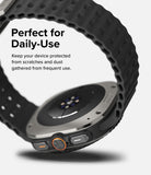 Galaxy Watch Ultra | Bezel Styling & Glass - Galaxy Watch Ultra - Close-up of the watch back and side buttons with a black textured strap against a white background.